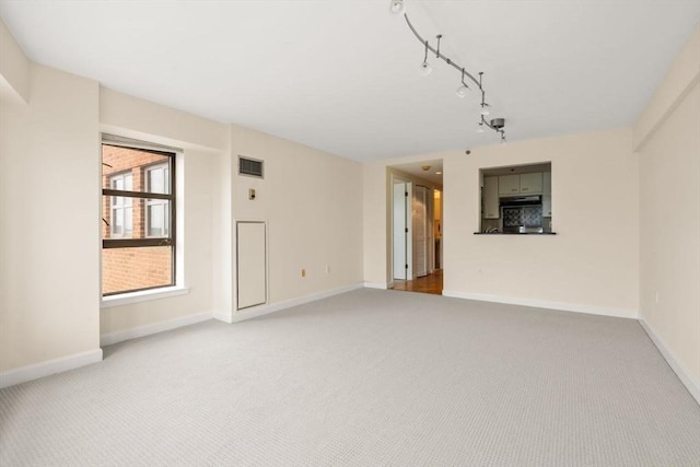 931 Massachusetts Ave Unit 1003, Cambridge, MA 02139 - empty room with carpet floors and track lighting