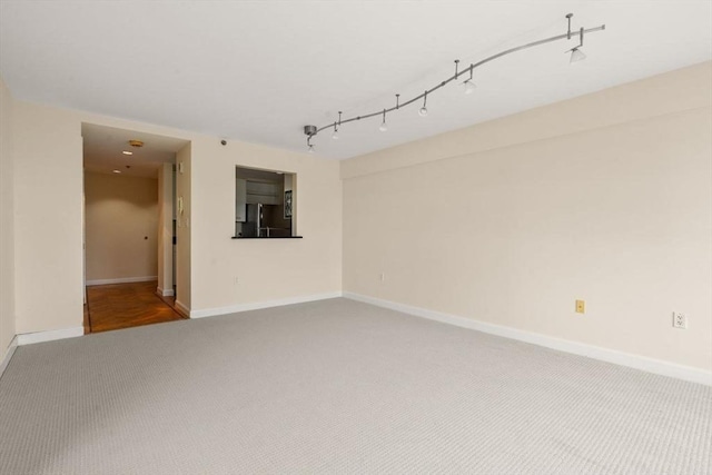 931 Massachusetts Ave Unit 1003, Cambridge, MA 02139 - spare room featuring carpet floors and baseboards