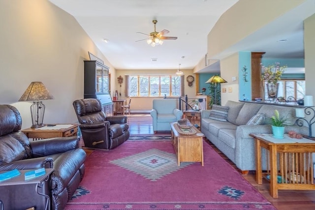living room featuring ceiling fan, vaulted ceiling, and wood finished floors