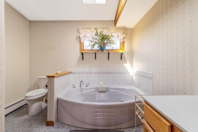 full bath featuring toilet, wallpapered walls, a tub with jets, and baseboard heating
