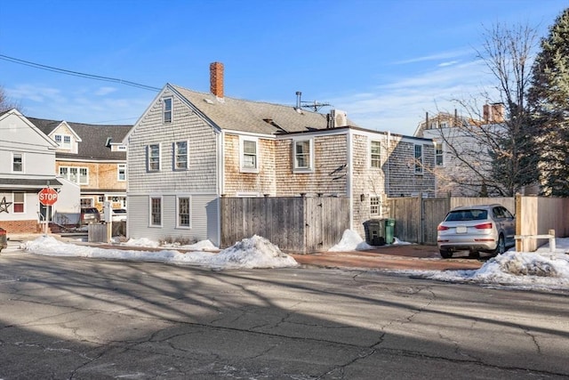 164 Water St Unit 164, Newburyport, MA 01950 - snow covered property featuring fence and a chimney