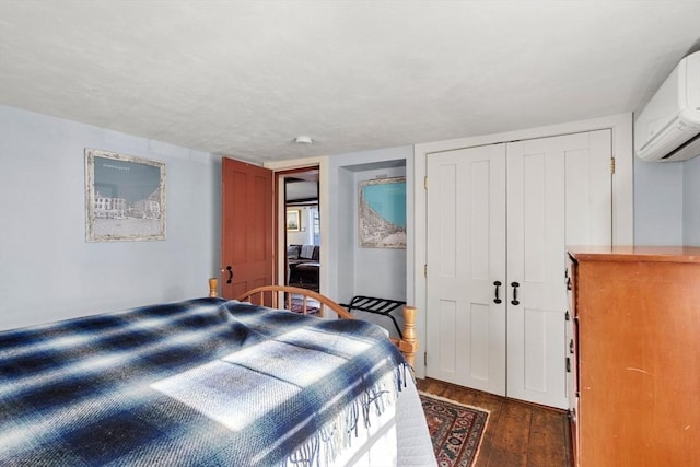 164 Water St Unit 164, Newburyport, MA 01950 - bedroom featuring dark wood finished floors, a wall mounted AC, and a closet