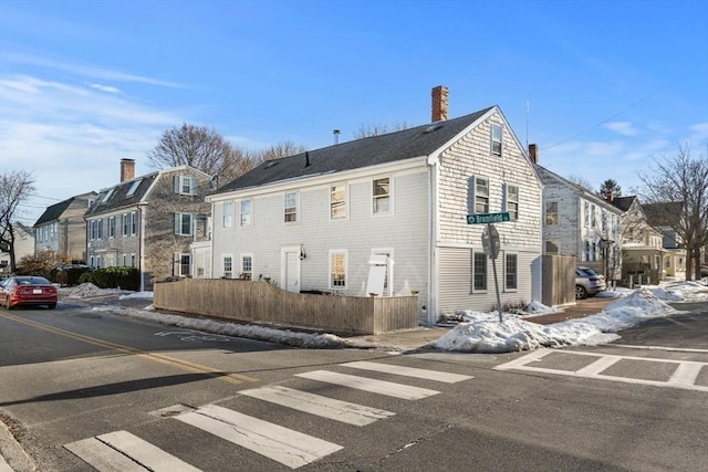 164 Water St Unit 164, Newburyport, MA 01950 - back of house with a residential view, a chimney, and fence