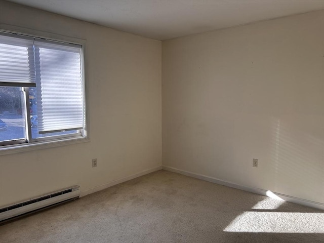 carpeted empty room with a baseboard heating unit