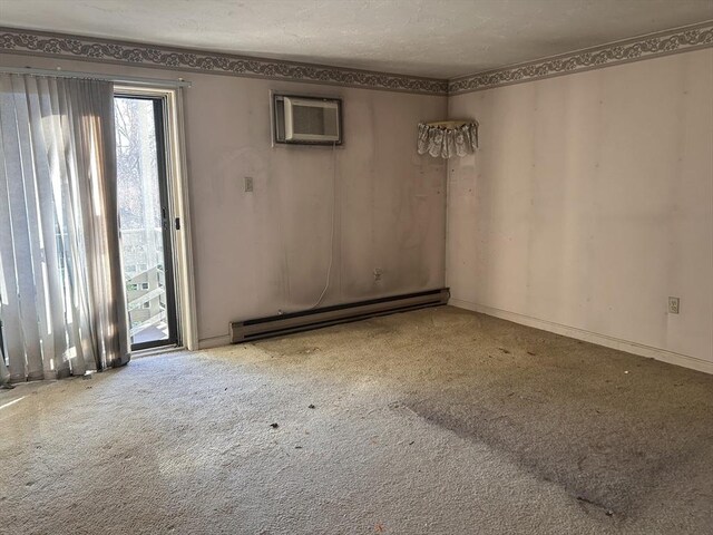 carpeted spare room with a wall mounted AC and baseboard heating