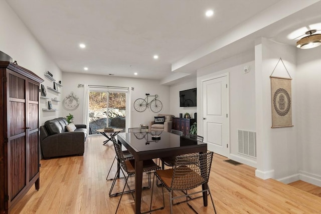 dining space with visible vents, recessed lighting, and light wood-style flooring