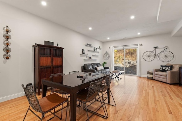 dining room featuring recessed lighting, baseboards, and light wood-type flooring