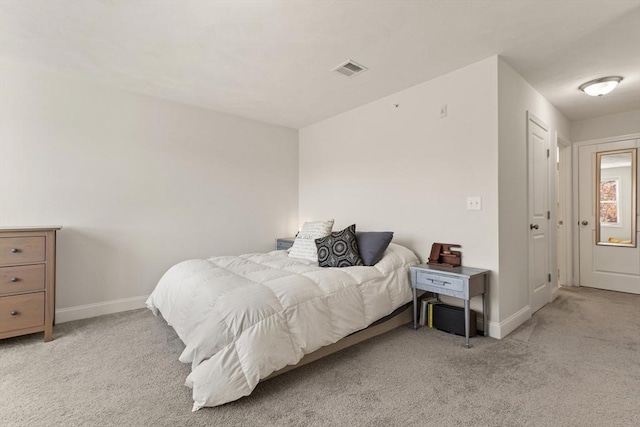 bedroom with visible vents, carpet, and baseboards