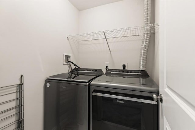 laundry area with laundry area and independent washer and dryer