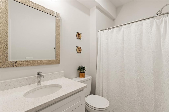 full bath featuring toilet and vanity