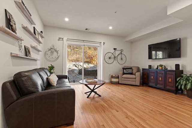 living area featuring recessed lighting, visible vents, and light wood-style flooring