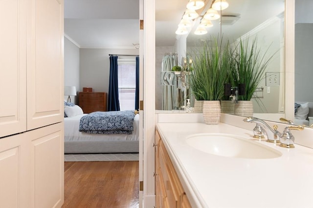 84 Commonwealth Ave Unit 4, Boston, MA 02116 - full bath with ornamental molding, ensuite bath, vanity, wood finished floors, and a chandelier