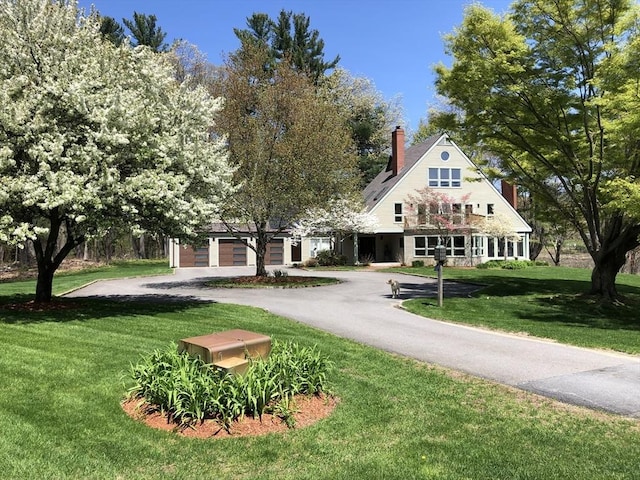 view of front facade with a front lawn and a garage