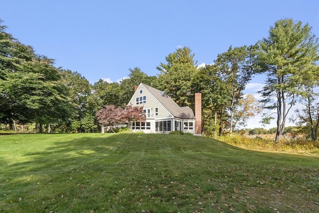 view of yard with a sunroom