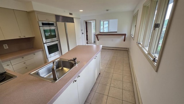 17 Crowningshield Dr, Paxton, MA 01612 - kitchen with a baseboard heating unit, stainless steel double oven, light tile patterned floors, paneled built in refrigerator, and recessed lighting