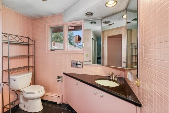 17 Crowningshield Dr, Paxton, MA 01612 - bathroom featuring a baseboard heating unit, tile walls, vanity, and tile patterned floors