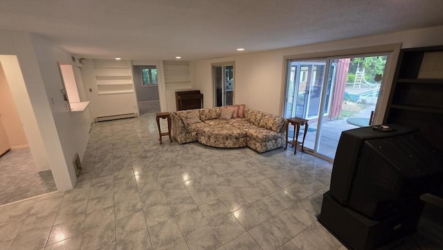 17 Crowningshield Dr, Paxton, MA 01612 - living area featuring a baseboard heating unit, plenty of natural light, recessed lighting, and built in shelves