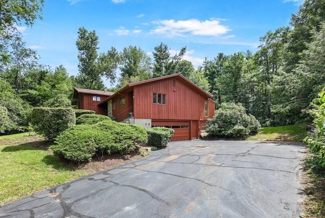 17 Crowningshield Dr, Paxton, MA 01612 - view of side of property with asphalt driveway and a garage