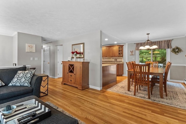 87 Lockwood Rd, Lynn, MA 01904 - living room with a chandelier, light wood finished floors, baseboards, ornamental molding, and recessed lighting