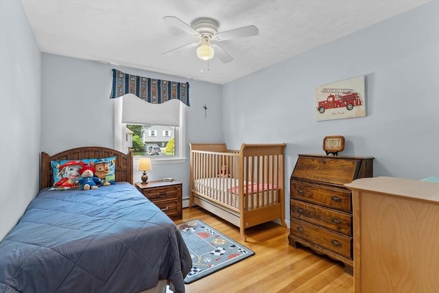 87 Lockwood Rd, Lynn, MA 01904 - bedroom featuring wood finished floors, baseboard heating, a baseboard heating unit, and ceiling fan