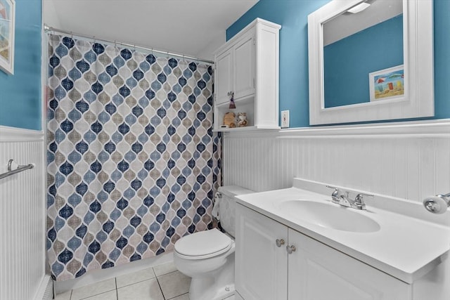 87 Lockwood Rd, Lynn, MA 01904 - full bath with a wainscoted wall, tile patterned flooring, toilet, vanity, and curtained shower