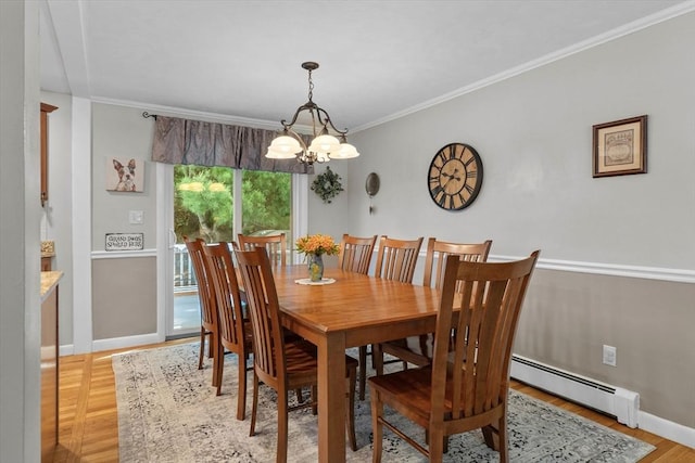 87 Lockwood Rd, Lynn, MA 01904 - dining area featuring a chandelier, baseboards, a baseboard radiator, crown molding, and light wood-style floors