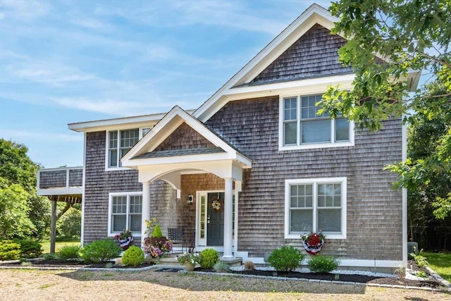 shingle-style home with covered porch