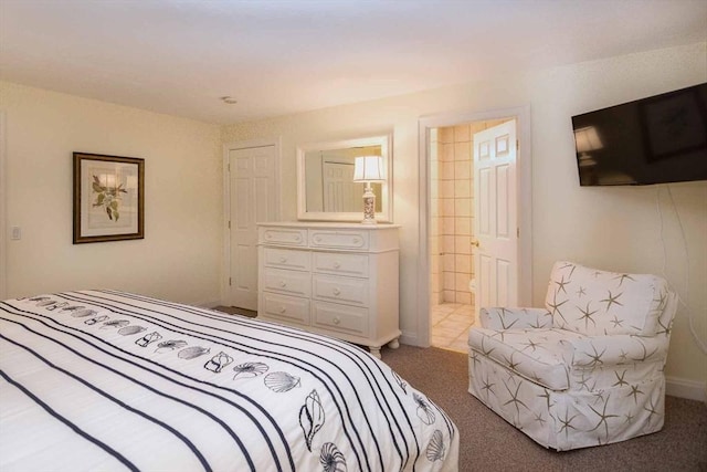 bedroom featuring carpet, baseboards, and connected bathroom