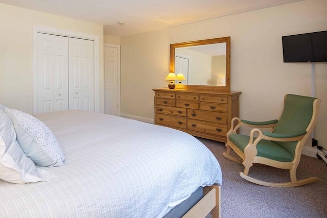 bedroom featuring carpet, baseboards, and a closet