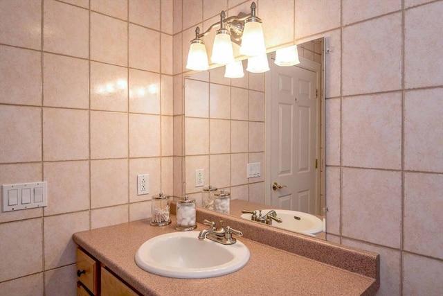 bathroom featuring tile walls and vanity