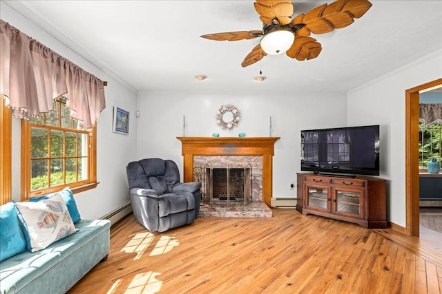 27 Crestview Dr, Uxbridge, MA 01569 - living room with hardwood / wood-style floors, ornamental molding, a ceiling fan, a baseboard heating unit, and a high end fireplace