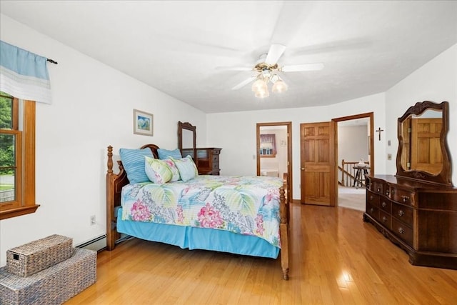 27 Crestview Dr, Uxbridge, MA 01569 - bedroom with wood finished floors, baseboard heating, and a ceiling fan
