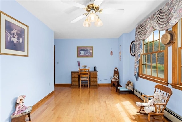 27 Crestview Dr, Uxbridge, MA 01569 - living area featuring light wood finished floors, baseboard heating, baseboards, an office area, and a ceiling fan