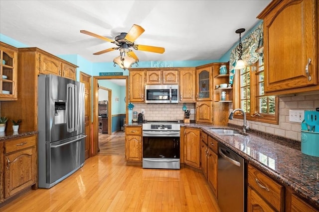27 Crestview Dr, Uxbridge, MA 01569 - kitchen featuring stainless steel appliances, a sink, and brown cabinetry
