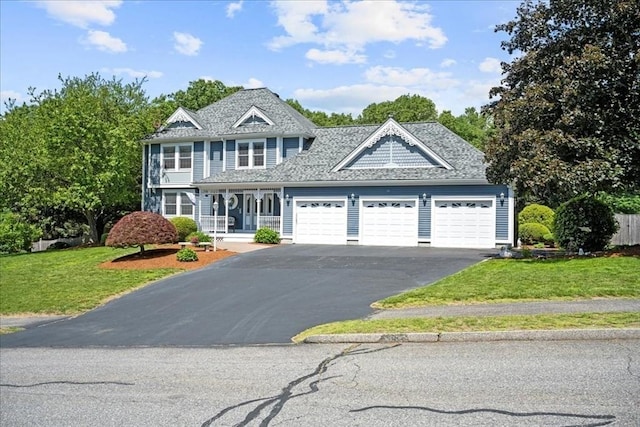 27 Crestview Dr, Uxbridge, MA 01569 - view of front of home featuring a garage, a front lawn, asphalt driveway, and covered porch