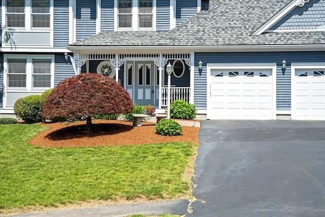 27 Crestview Dr, Uxbridge, MA 01569 - doorway to property with driveway, a garage, a shingled roof, and a yard