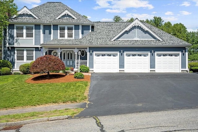 27 Crestview Dr, Uxbridge, MA 01569 - view of front of house with a garage, asphalt driveway, a front yard, and roof with shingles