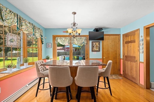 27 Crestview Dr, Uxbridge, MA 01569 - dining space with baseboard heating, a chandelier, and light wood finished floors