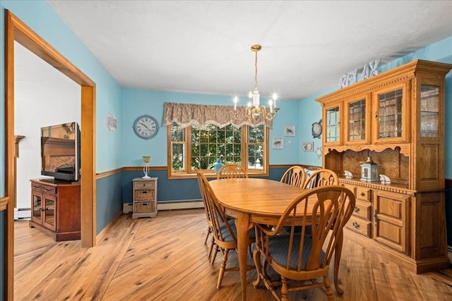 27 Crestview Dr, Uxbridge, MA 01569 - dining room featuring a baseboard heating unit, a chandelier, and light wood-style flooring