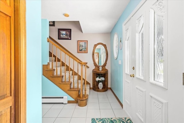 27 Crestview Dr, Uxbridge, MA 01569 - entrance foyer with a baseboard heating unit, stairway, light tile patterned floors, and baseboards
