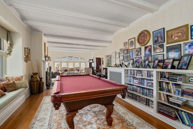 recreation room with ornamental molding, hardwood / wood-style flooring, billiards, and beam ceiling