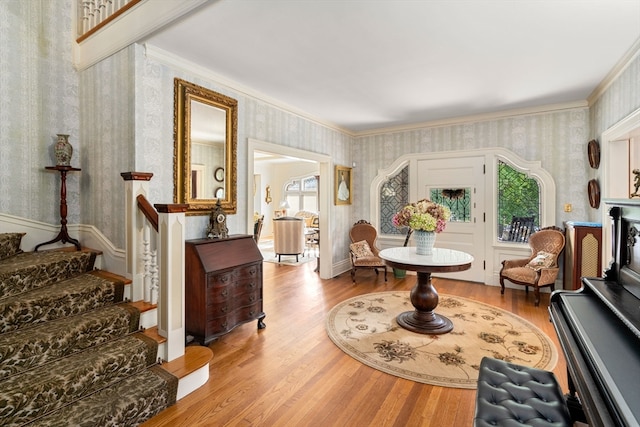 interior space featuring ornamental molding and hardwood / wood-style floors