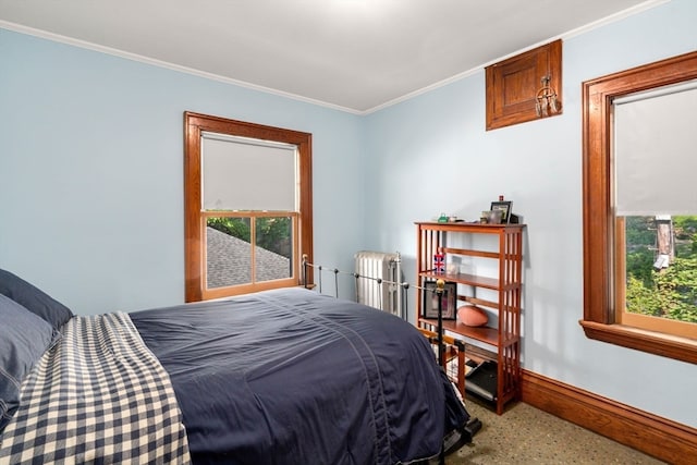 bedroom with radiator heating unit and ornamental molding