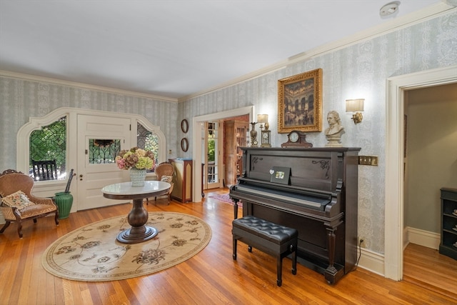 misc room with ornamental molding and wood-type flooring