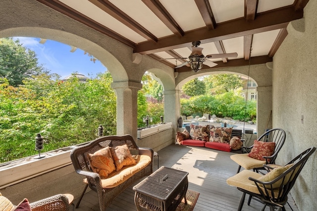 exterior space with an outdoor living space and ceiling fan