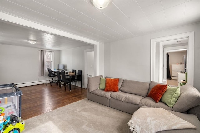 living area with light wood-type flooring and a baseboard radiator