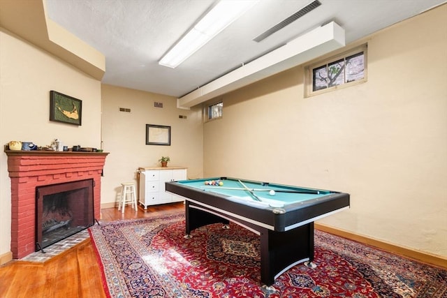 36 Blake Rd, Brookline, MA 02445 - game room featuring pool table, baseboards, visible vents, a brick fireplace, and wood finished floors