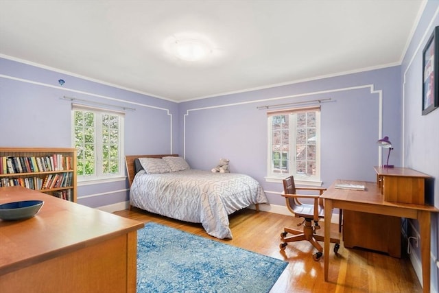 36 Blake Rd, Brookline, MA 02445 - bedroom featuring crown molding, baseboards, and wood finished floors