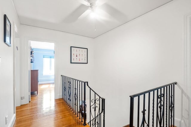36 Blake Rd, Brookline, MA 02445 - hallway featuring baseboards, an upstairs landing, and wood finished floors