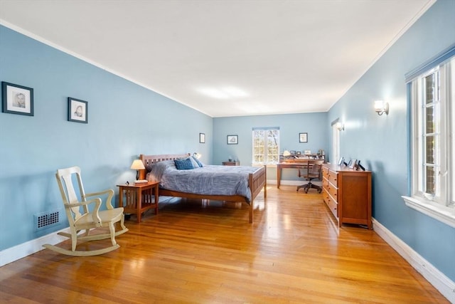 36 Blake Rd, Brookline, MA 02445 - bedroom featuring light wood finished floors, visible vents, baseboards, and ornamental molding